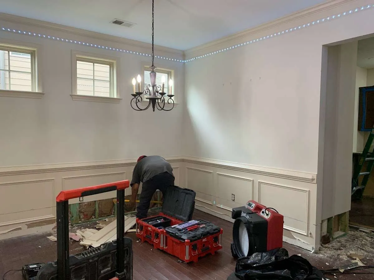 Restoration technician with professional equipment in Raritan